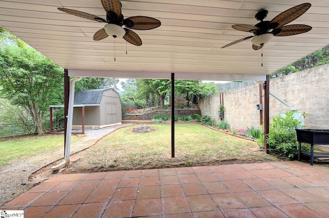 602 Habersham Ln, Easley, SC 29642 - view of patio featuring an outbuilding, a ceiling fan, a fenced backyard, and a shed