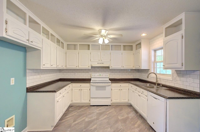 602 Habersham Ln, Easley, SC 29642 - kitchen featuring a sink, dark countertops, under cabinet range hood, and white appliances