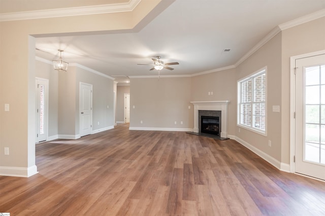 241 Carriage Gate Dr, Wellford, SC 29385 - unfurnished living room with crown molding, ceiling fan, wood finished floors, and a fireplace