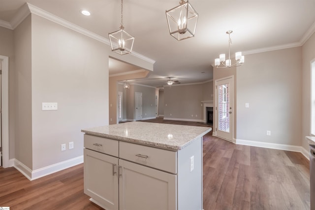 241 Carriage Gate Dr, Wellford, SC 29385 - kitchen with baseboards, ornamental molding, and wood finished floors