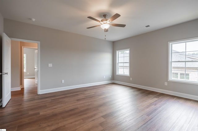 241 Carriage Gate Dr, Wellford, SC 29385 - empty room featuring baseboards, ceiling fan, and dark wood-style floors