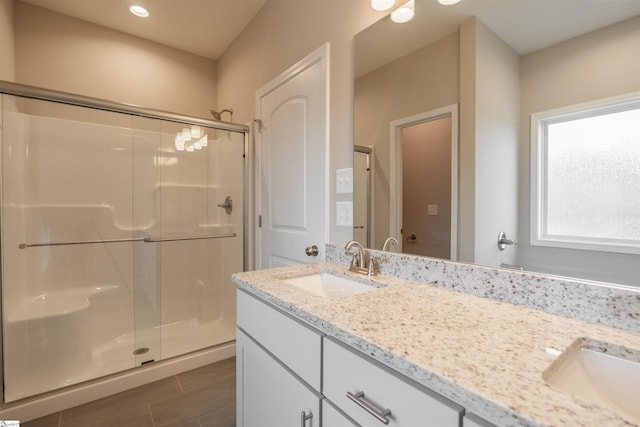 241 Carriage Gate Dr, Wellford, SC 29385 - bathroom with double vanity, a sink, and a shower stall