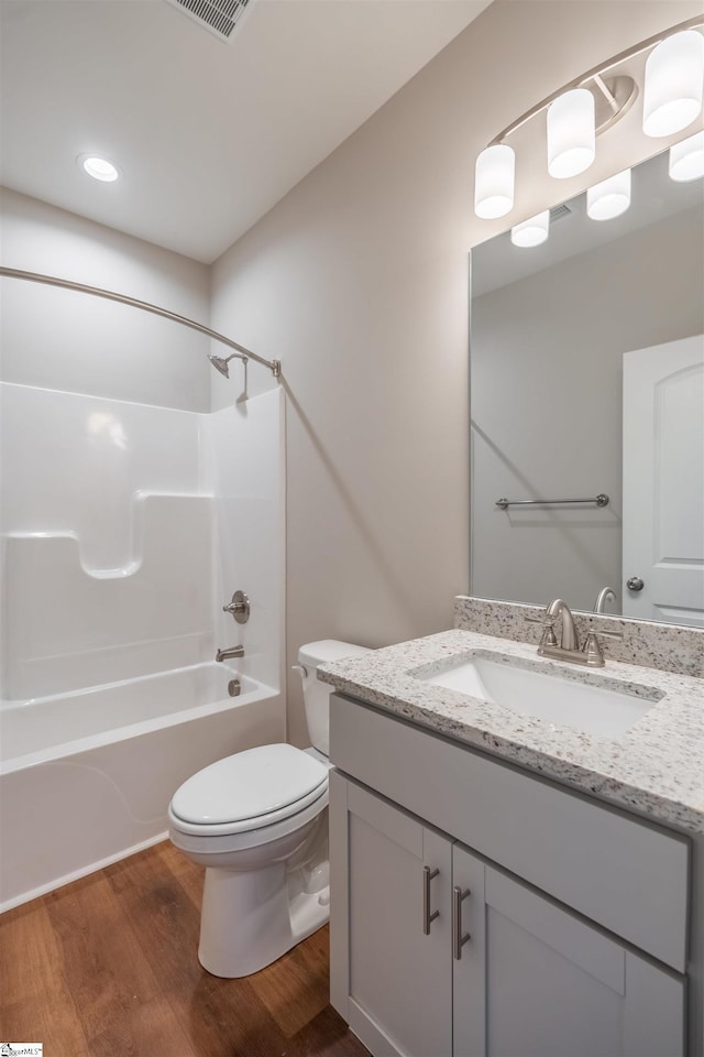 241 Carriage Gate Dr, Wellford, SC 29385 - full bath featuring washtub / shower combination, vanity, toilet, wood finished floors, and visible vents