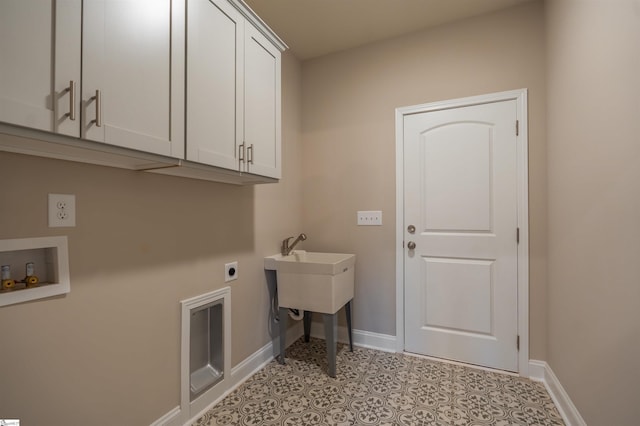 241 Carriage Gate Dr, Wellford, SC 29385 - laundry area featuring electric dryer hookup, cabinet space, and baseboards