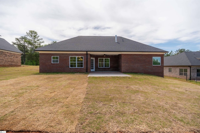 241 Carriage Gate Dr, Wellford, SC 29385 - rear view of property featuring roof with shingles, brick siding, a ceiling fan, a patio, and a yard