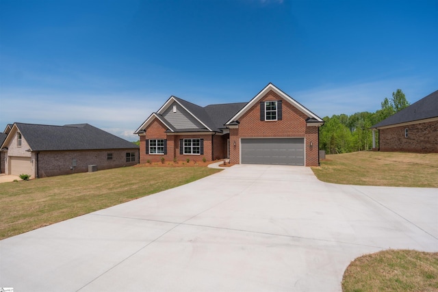 241 Carriage Gate Dr, Wellford, SC 29385 - view of front of house featuring brick siding, an attached garage, driveway, and a front lawn