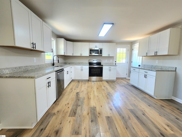 509 Allgood Bridge Rd, Pickens, SC 29671 - kitchen featuring appliances with stainless steel finishes, a wealth of natural light, a sink, and light wood-style flooring