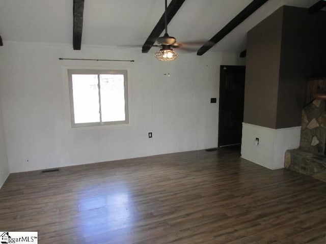 unfurnished living room featuring dark wood-style flooring, a ceiling fan, visible vents, and vaulted ceiling with beams