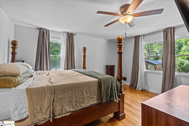bedroom with a ceiling fan and wood finished floors