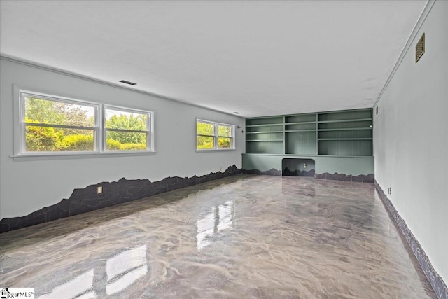 unfurnished living room featuring visible vents
