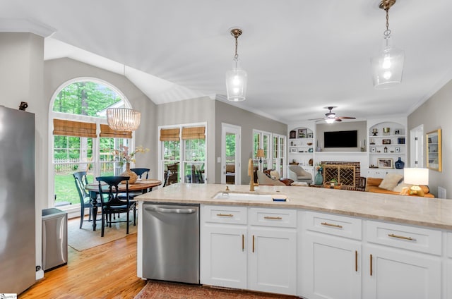 4 Barley Mill Dr, Greer, SC 29651 - kitchen with white cabinets, ceiling fan, appliances with stainless steel finishes, light stone countertops, and a sink
