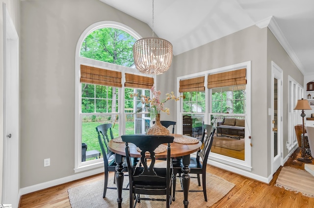 4 Barley Mill Dr, Greer, SC 29651 - dining space featuring baseboards, ornamental molding, light wood finished floors, and a chandelier