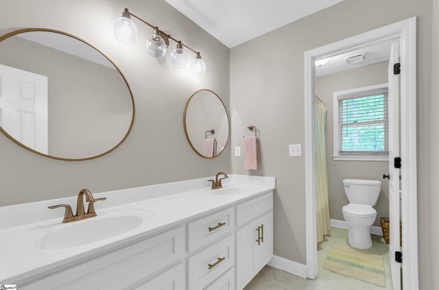 4 Barley Mill Dr, Greer, SC 29651 - bathroom featuring visible vents, double vanity, toilet, baseboards, and a sink