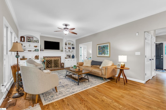 4 Barley Mill Dr, Greer, SC 29651 - living area with light wood-style floors, a ceiling fan, baseboards, and built in shelves