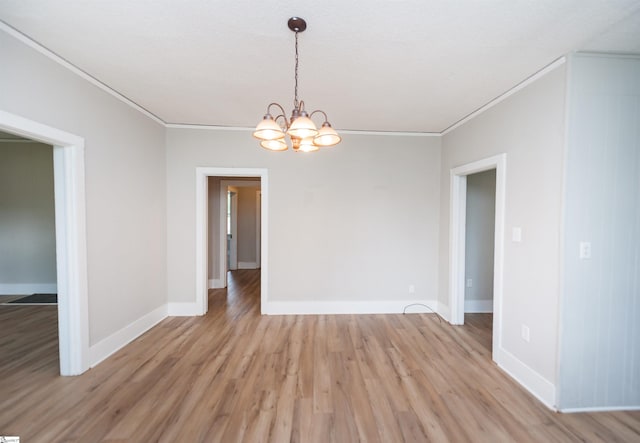 14 Damson St, Spartanburg, SC 29303 - unfurnished dining area featuring crown molding, an inviting chandelier, and light wood-style flooring