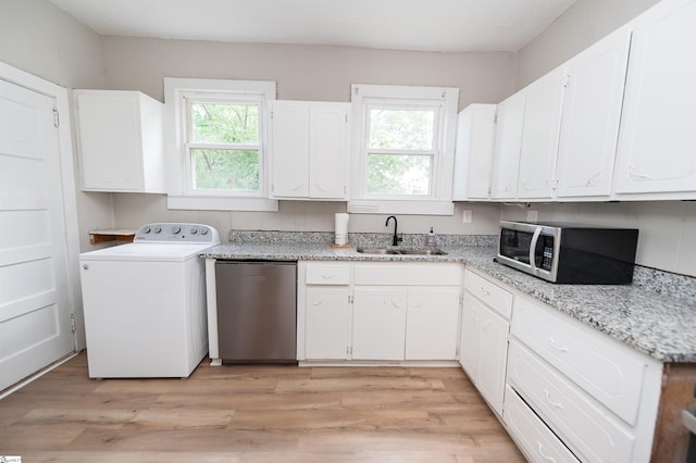 14 Damson St, Spartanburg, SC 29303 - kitchen featuring stainless steel appliances, washer / dryer, a healthy amount of sunlight, and a sink