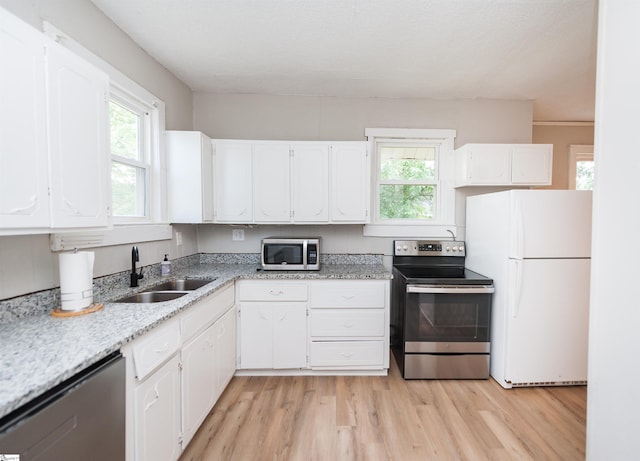 14 Damson St, Spartanburg, SC 29303 - kitchen featuring white cabinets, appliances with stainless steel finishes, and a sink
