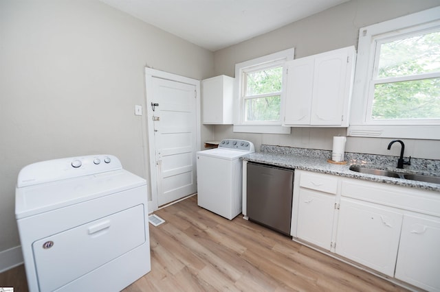 14 Damson St, Spartanburg, SC 29303 - laundry room featuring laundry area, a sink, washer / clothes dryer, and light wood-type flooring