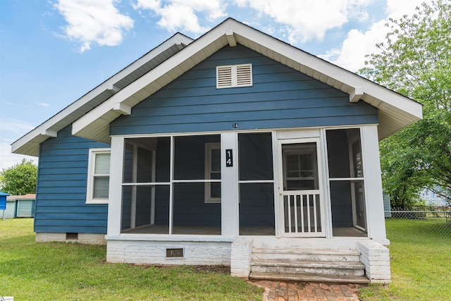 14 Damson St, Spartanburg, SC 29303 - back of house featuring fence, a lawn, a sunroom, and crawl space