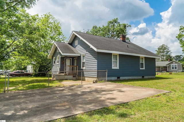 14 Damson St, Spartanburg, SC 29303 - exterior space featuring a lawn, roof with shingles, fence, and a chimney