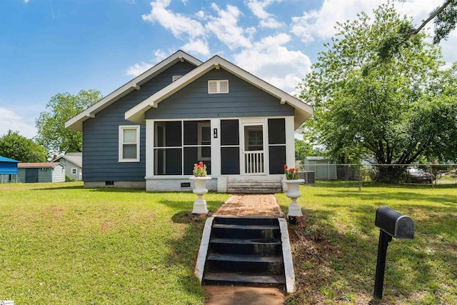 14 Damson St, Spartanburg, SC 29303 - back of property featuring a sunroom, a lawn, and fence