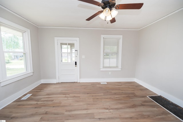 14 Damson St, Spartanburg, SC 29303 - entrance foyer featuring crown molding, light wood-style floors, and a healthy amount of sunlight