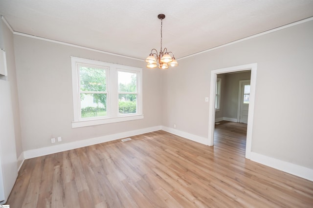 14 Damson St, Spartanburg, SC 29303 - spare room with plenty of natural light, ornamental molding, and a notable chandelier