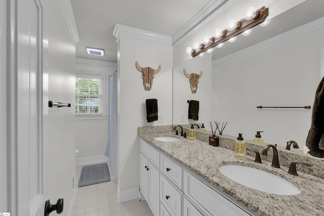 bathroom featuring a sink, tile patterned flooring, ornamental molding, and double vanity