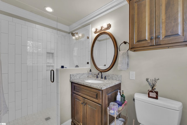full bathroom with toilet, a shower stall, ornamental molding, and vanity