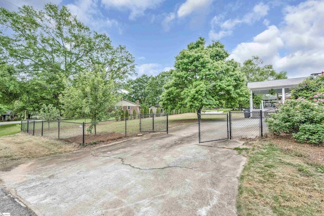 view of gate with fence