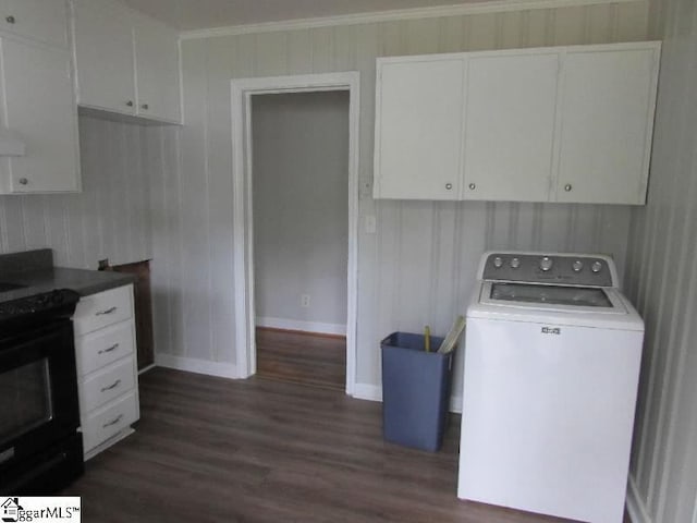laundry room featuring ornamental molding, washer / dryer, baseboards, dark wood-type flooring, and cabinet space