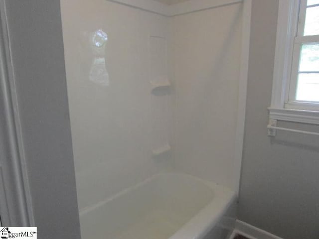 full bathroom with baseboards