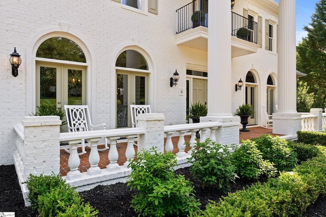 312 Stonebrook Farm Way, Greenville, SC 29615 - exterior space featuring brick siding, a balcony, french doors, and a porch