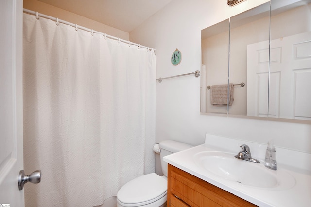 full bath featuring toilet, a shower with shower curtain, and vanity