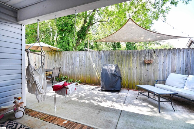 view of patio featuring a fenced backyard and area for grilling