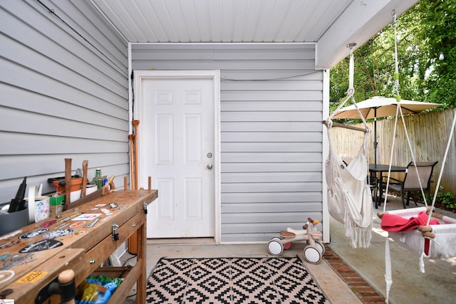 doorway to property with fence