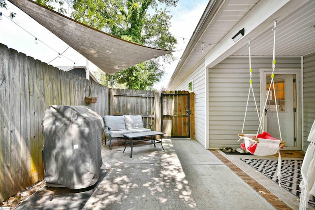 view of patio / terrace with fence and area for grilling