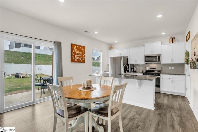 75 Oak Edge Ln, Greer, SC 29651 - dining area featuring recessed lighting, visible vents, and wood finished floors