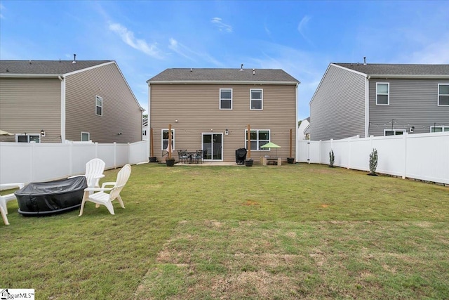75 Oak Edge Ln, Greer, SC 29651 - back of house with a fenced backyard, a patio, a lawn, and a fire pit