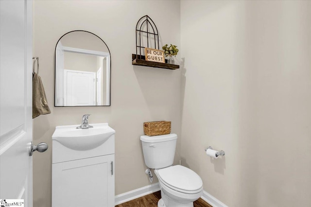 75 Oak Edge Ln, Greer, SC 29651 - bathroom with toilet, baseboards, wood finished floors, and vanity