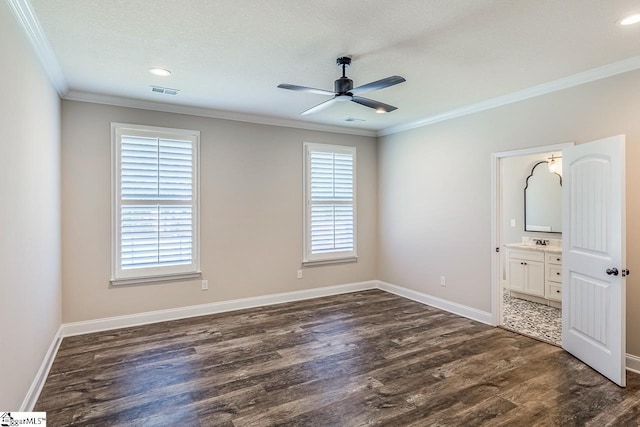 unfurnished bedroom featuring baseboards, ornamental molding, and dark wood-style flooring