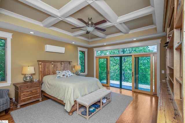 bedroom with wood finished floors, beam ceiling, an AC wall unit, access to outside, and coffered ceiling