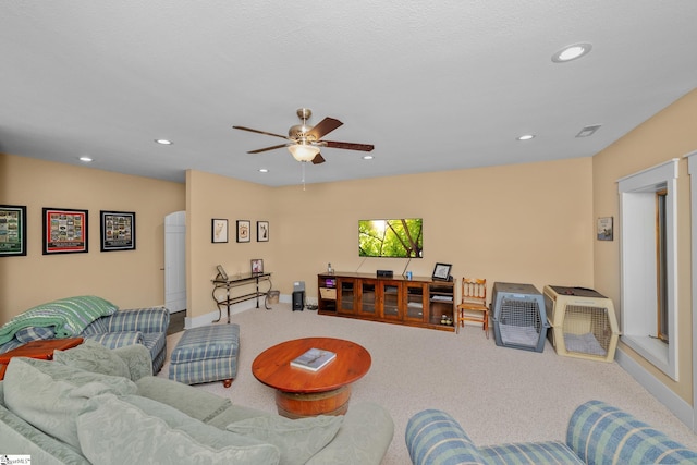 carpeted living area with baseboards, a ceiling fan, recessed lighting, and visible vents