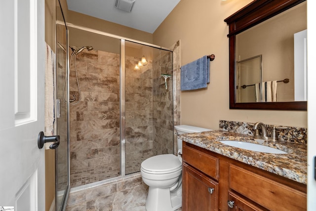 full bath with vanity, visible vents, toilet, and a shower stall