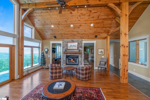 living room with wood finished floors, a fireplace, high vaulted ceiling, wood ceiling, and a ceiling fan