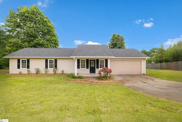 ranch-style house featuring fence, a front yard, concrete driveway, an attached garage, and a porch