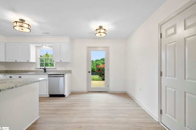 kitchen featuring light stone countertops, white cabinetry, baseboards, light wood-type flooring, and stainless steel dishwasher