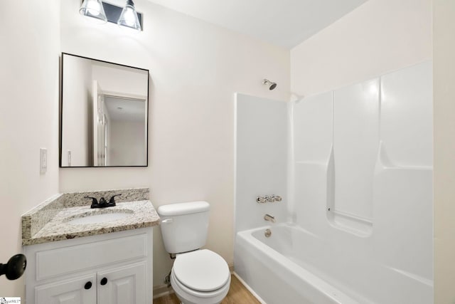 full bathroom featuring vanity, baseboards, toilet, and shower / washtub combination