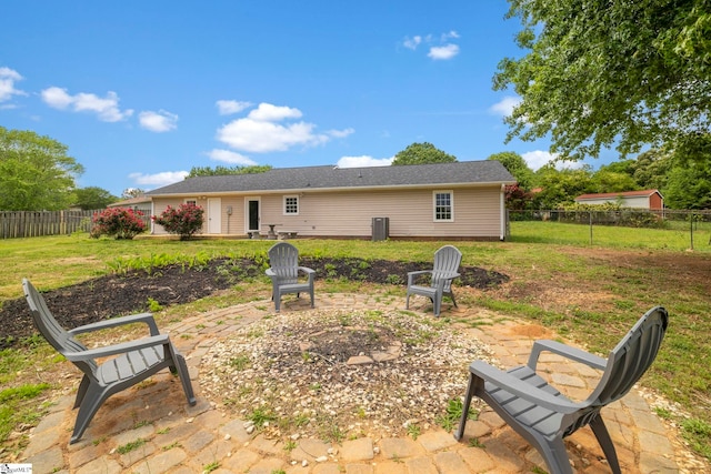 back of property featuring a lawn and a fenced backyard