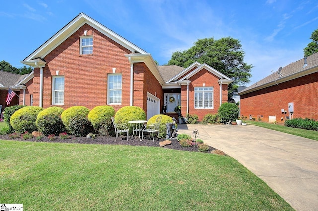 132 Hartsfield Dr, Easley, SC 29642 - view of front of home with a garage, concrete driveway, a front yard, and brick siding